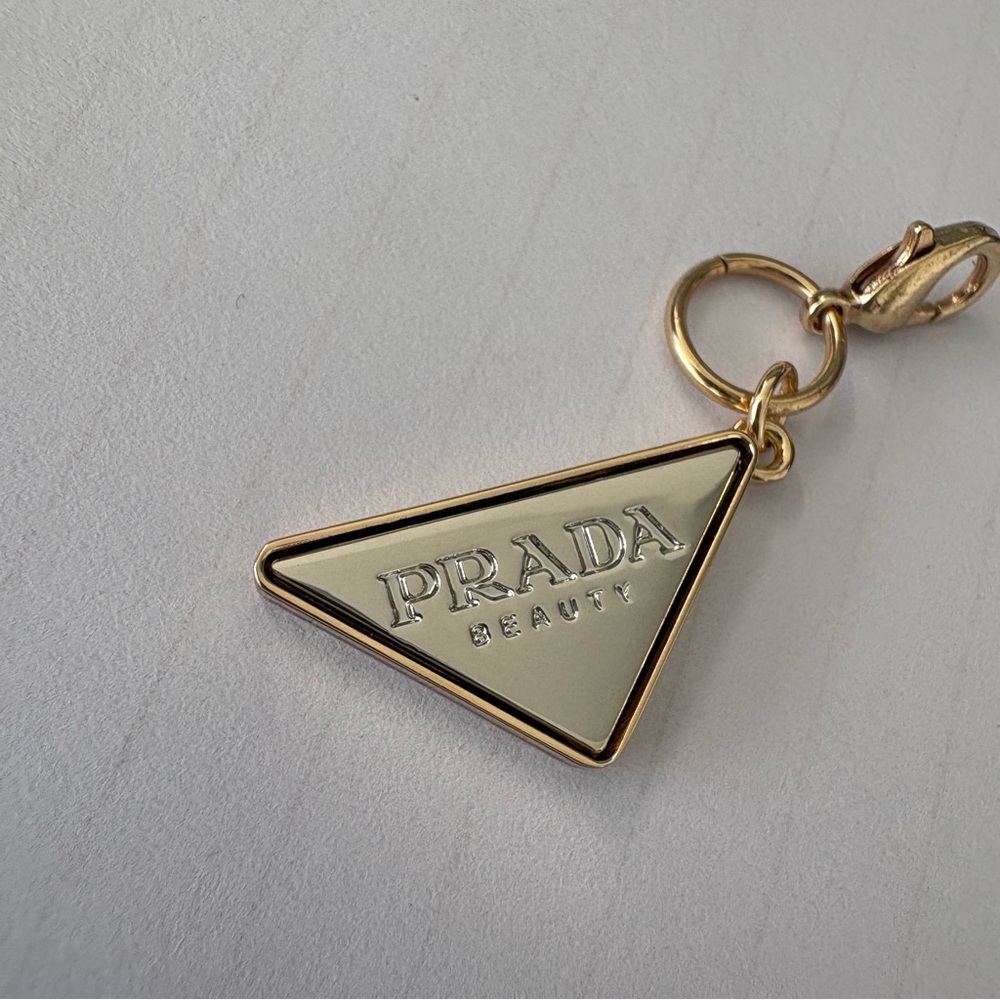 Prada Gold Triangle Logo Charm with Cream Enamel - Picture 2 of 9